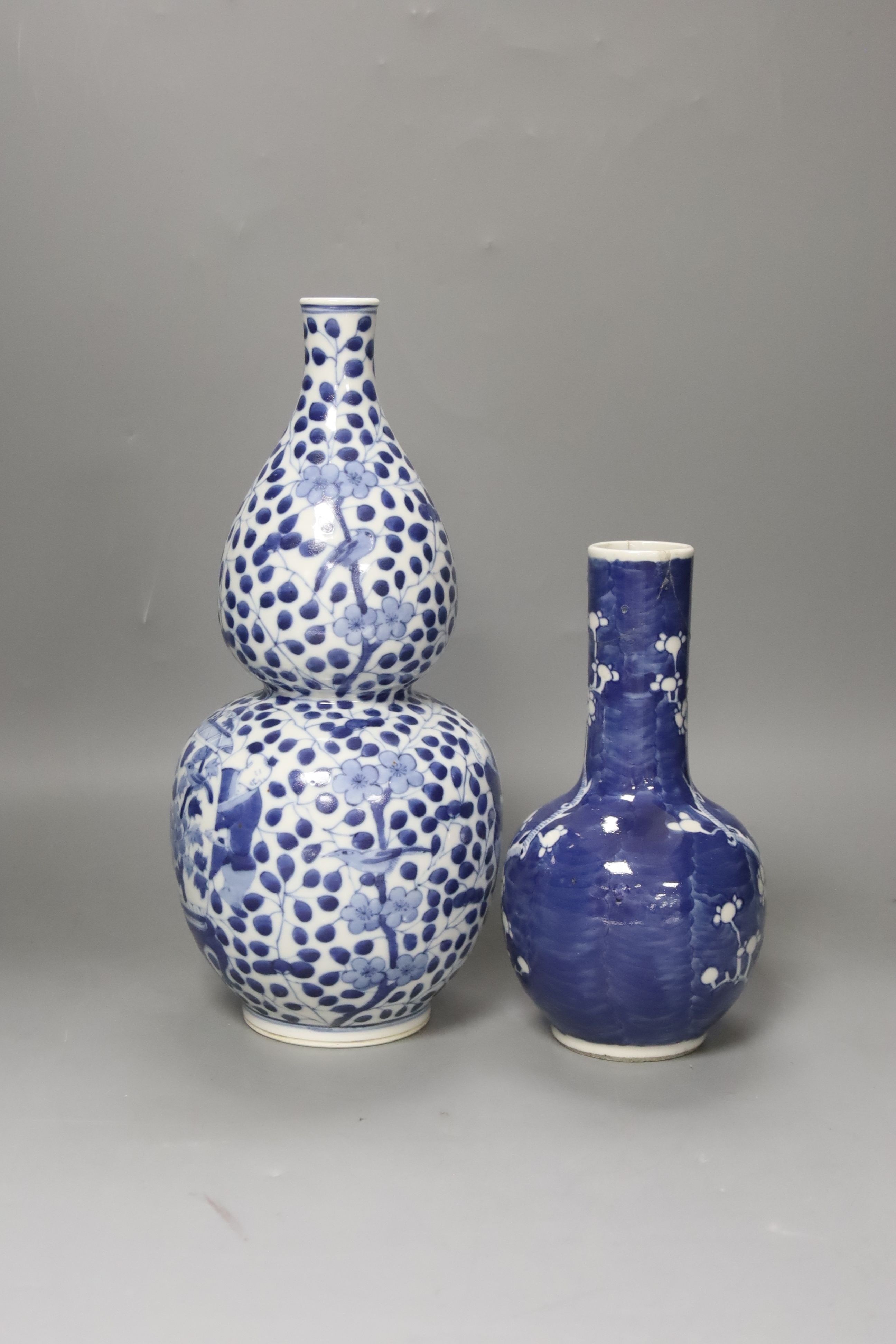 Two Chinese blue and white vases, tallest 29cm
